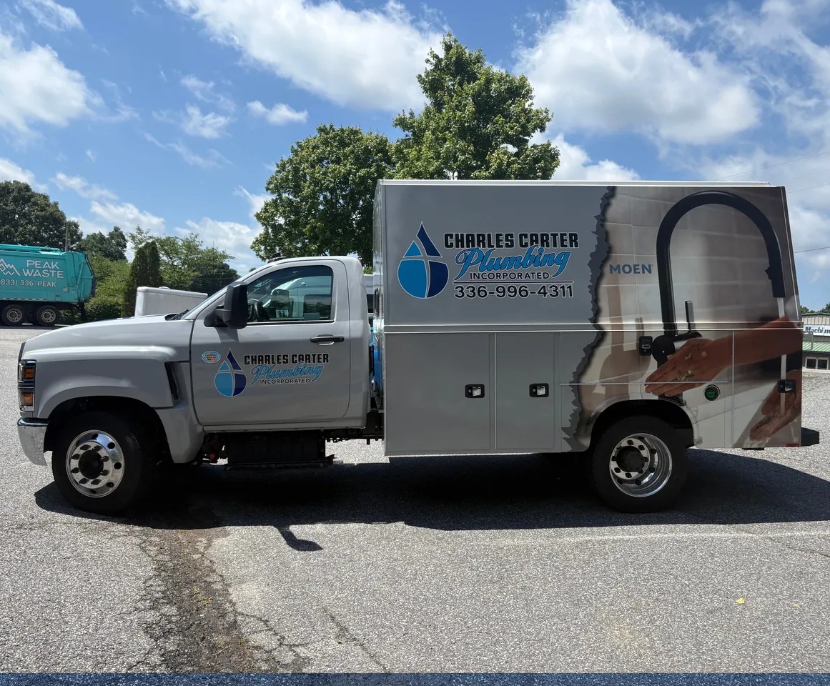 Charles Carter Plumbing service truck with branded vehicle graphics