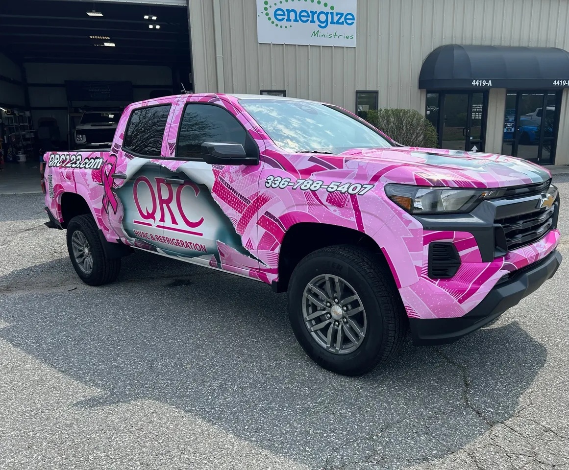 Pink color-change car wrap on an ORC pickup truck